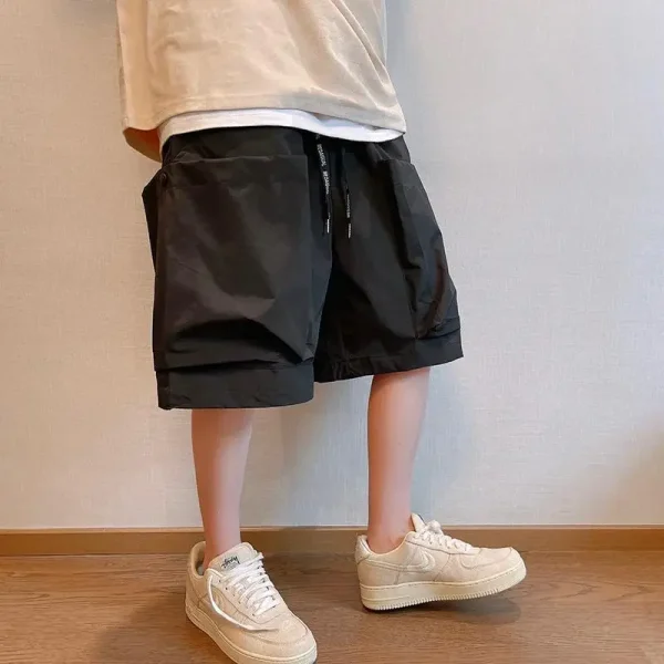 short cargo noir homme grandes poches